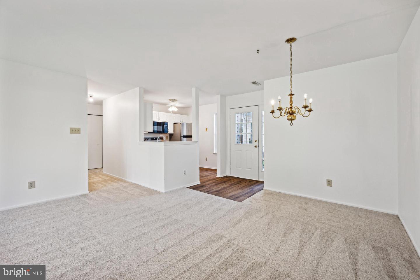1107 Squirrel Road Marlton, NJ 08053 - Photo 10 of 24 a view of a kitchen with a refrigerator windows and a ceiling fan