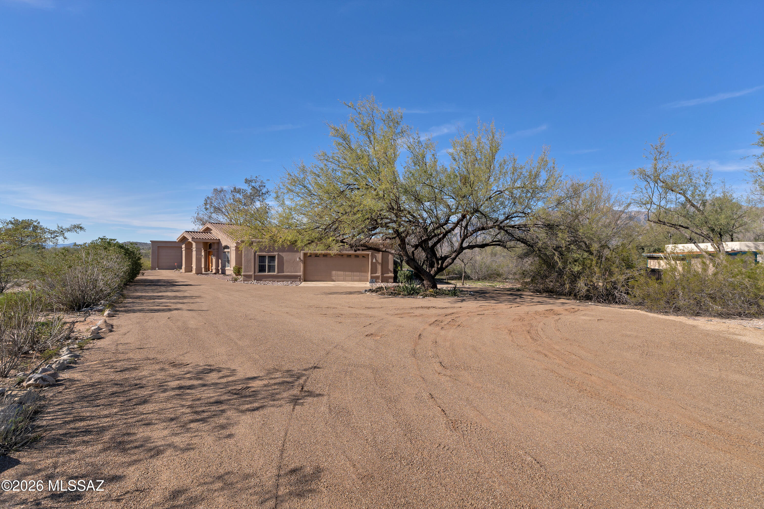 4001 North Harrison Road Tucson, AZ 85749 - Photo 5 of 50 a front view of a house with a yard