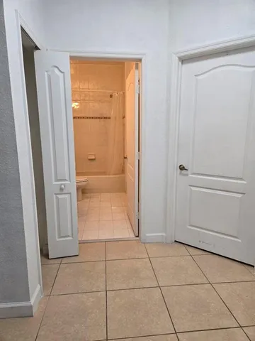 a stove top oven sitting inside of a kitchen