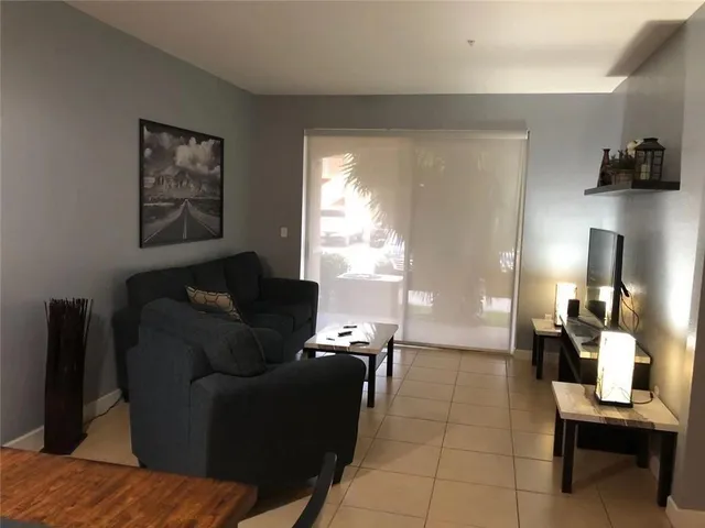 a living room with furniture and a window