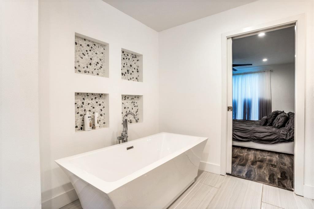 6014 East Mockingbird Lane Dallas, TX 75206 - Photo 11 of 17 a bathroom with a bathtub and shower