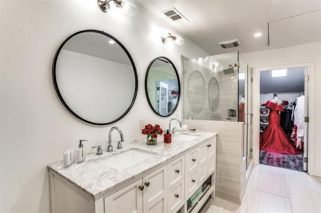 6014 East Mockingbird Lane Dallas, TX 75206 - Photo 12 of 17 a bathroom with a sink and a mirror