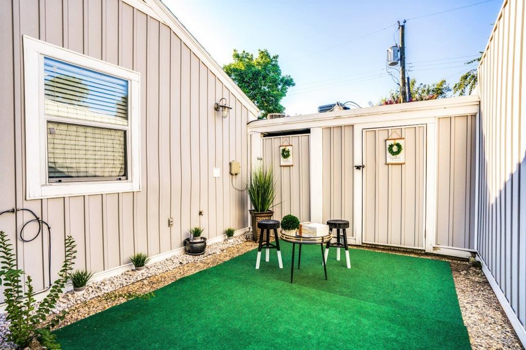 6014 East Mockingbird Lane Dallas, TX 75206 - Photo 16 of 17 a backyard of a house with table and chairs