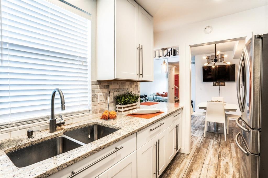 6014 East Mockingbird Lane Dallas, TX 75206 - Photo 2 of 17 a kitchen with a sink and a stove top oven