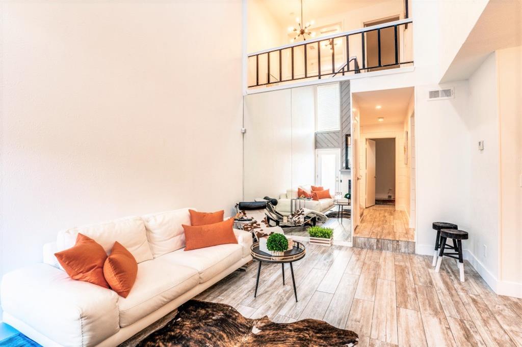 6014 East Mockingbird Lane Dallas, TX 75206 - Photo 3 of 17 a living room with furniture and a wooden floor