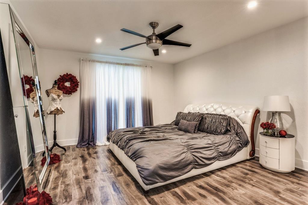 6014 East Mockingbird Lane Dallas, TX 75206 - Photo 9 of 17 a bedroom with a bed and ceiling fan