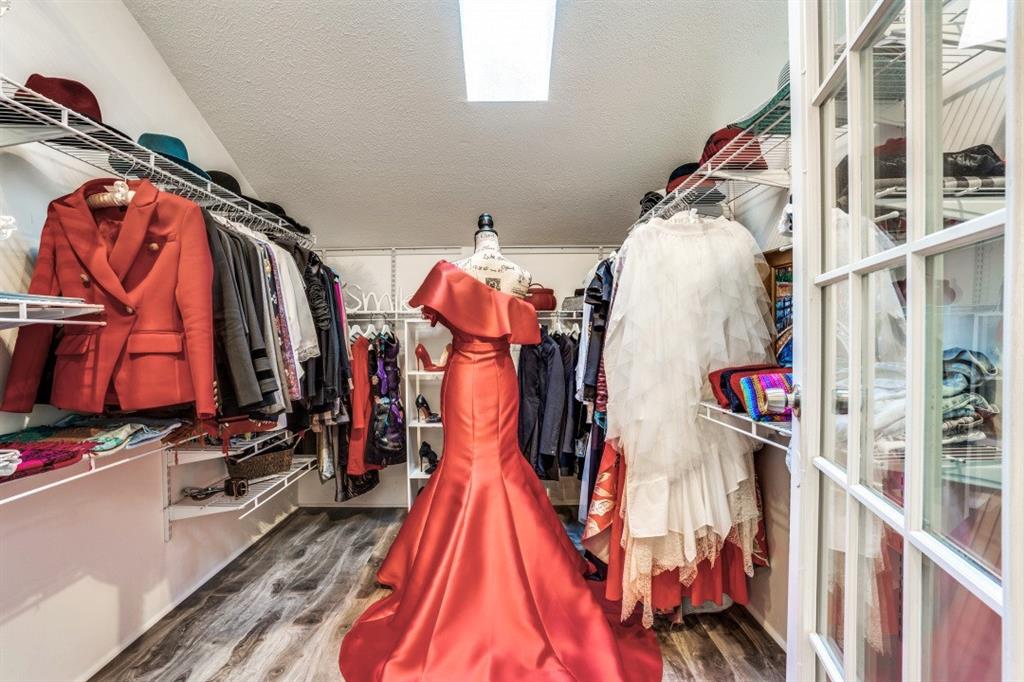 6014 East Mockingbird Lane Dallas, TX 75206 - Photo 10 of 17 a view of walk in closet with clothes and shoes