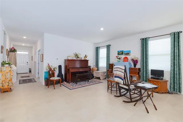 a view of a livingroom with furniture and a flat screen tv