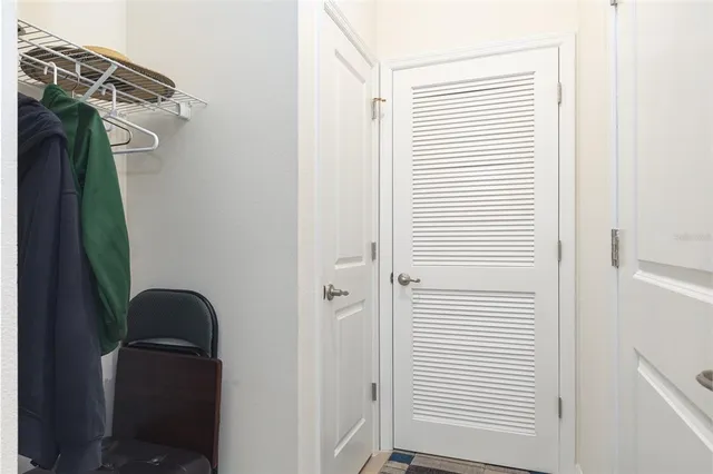 a living room with furniture a dining table and a piano