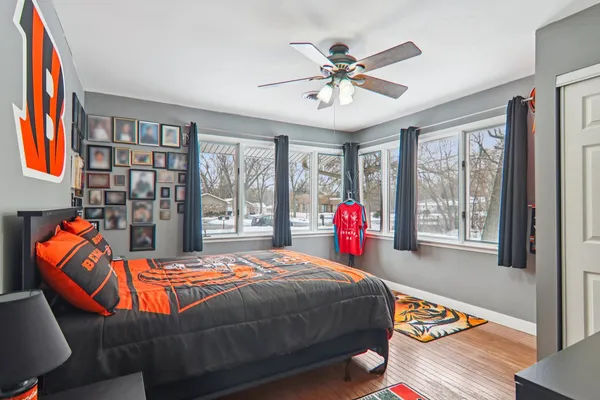 a bed room with a bed and a chandelier