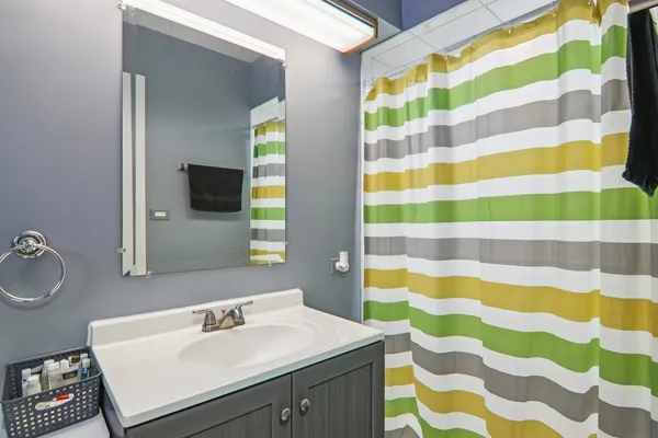 a bathroom with a sink and a mirror