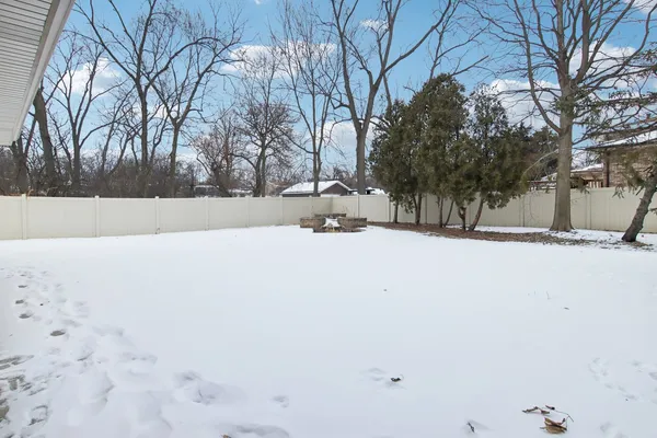 a street view with snow on the road