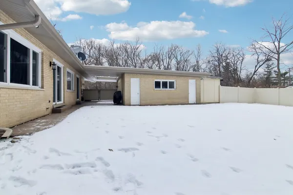a view of a backyard of the house