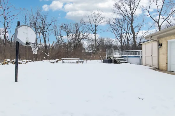 a view of snow on the side of a road