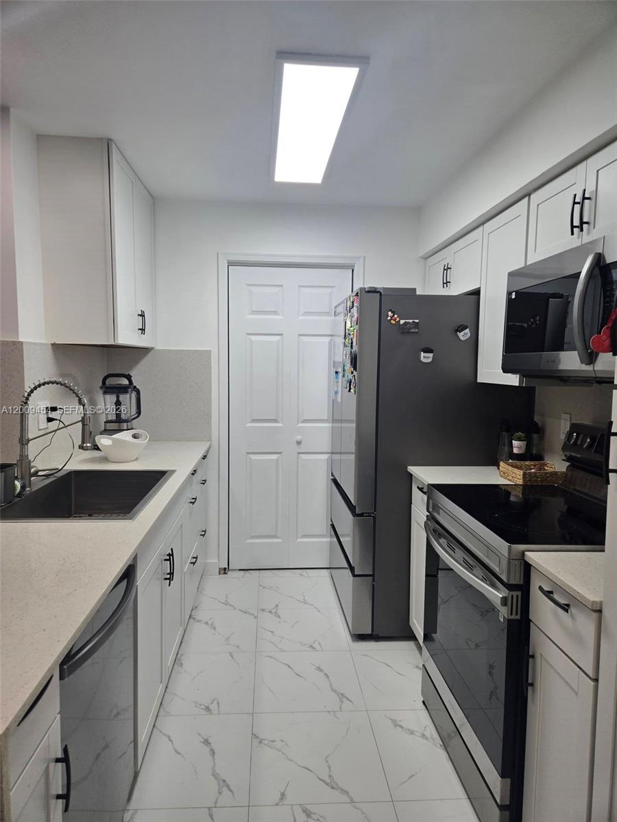 733 Riverside Drive, Unit 1210 Coral Springs, FL 33071 - Photo 8 of 22 Kitchen