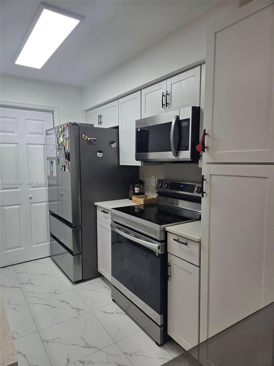 733 Riverside Drive, Unit 1210 Coral Springs, FL 33071 - Photo 9 of 22 Kitchen