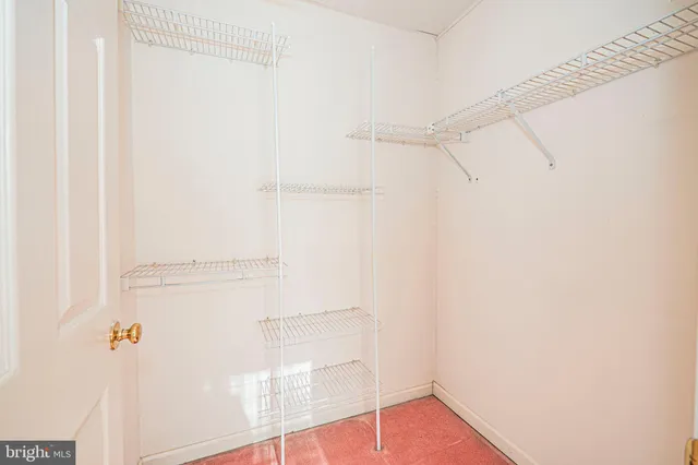 a bathroom with a toilet sink vanity and mirror