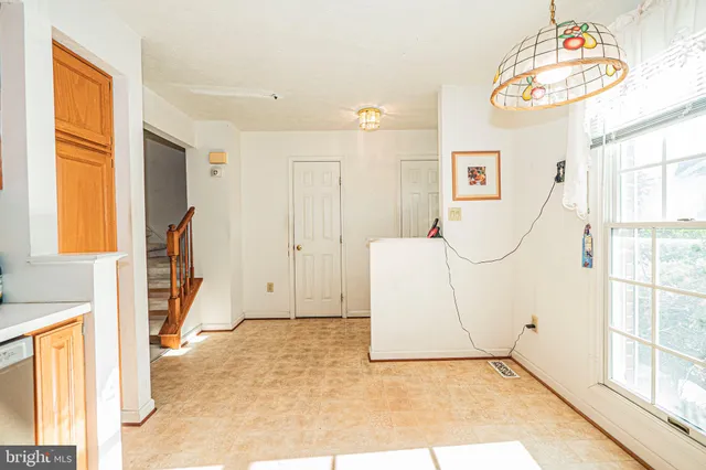 a view of an entryway with wooden floor