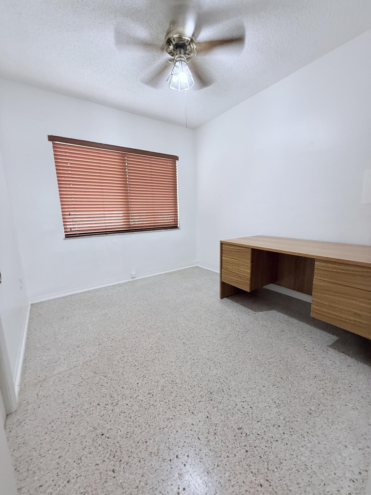 957 West 67th Street Hialeah, FL 33012 - Photo 13 of 15 a view of an empty room with window