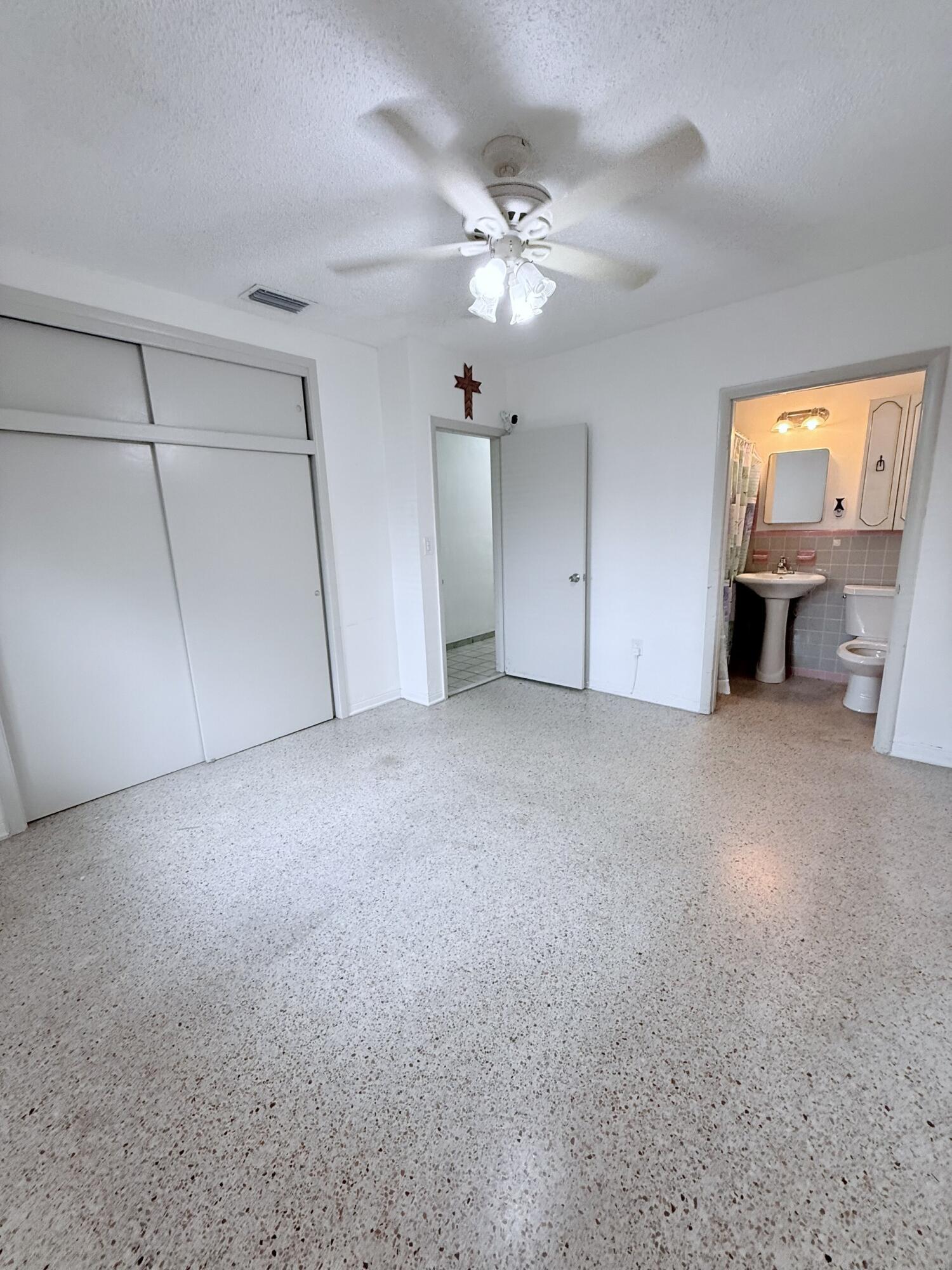 957 West 67th Street Hialeah, FL 33012 - Photo 9 of 15 a view of an empty room with a fireplace