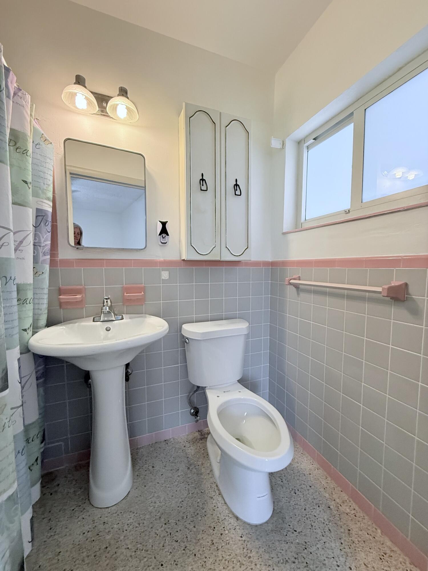957 West 67th Street Hialeah, FL 33012 - Photo 10 of 15 a bathroom with a sink toilet and mirror