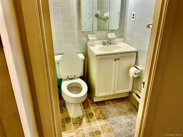a bathroom with a sink and toilet