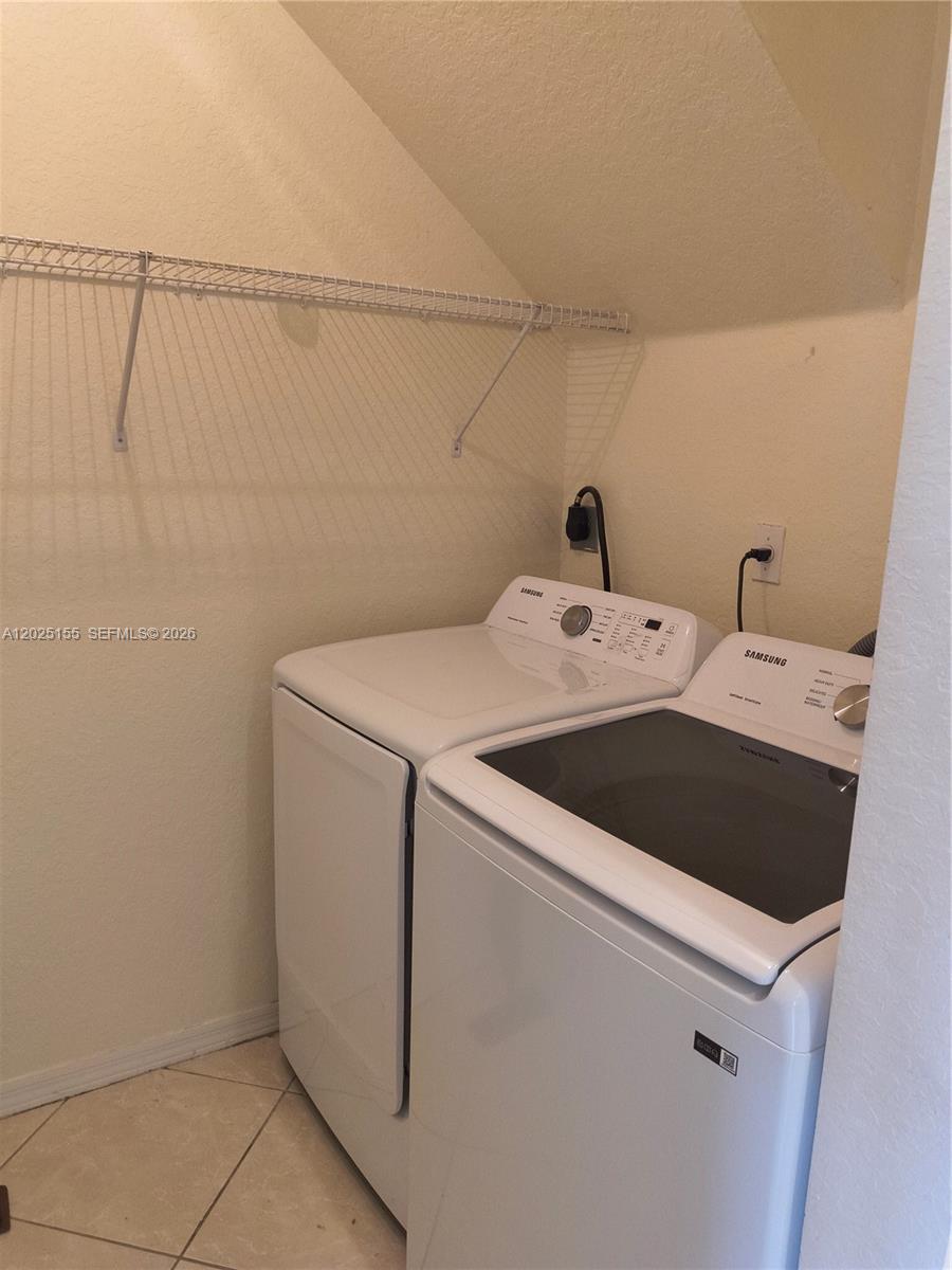 1645 Southeast 20th Road, Unit 1645 Homestead, FL 33035 - Photo 9 of 20 a utility room with dryer and washer