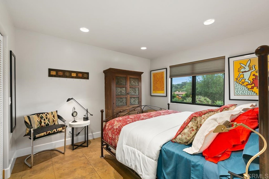 230 Winterhawk Lane Encinitas, CA 92024 - Photo 18 of 28 a bedroom with a bed and a window