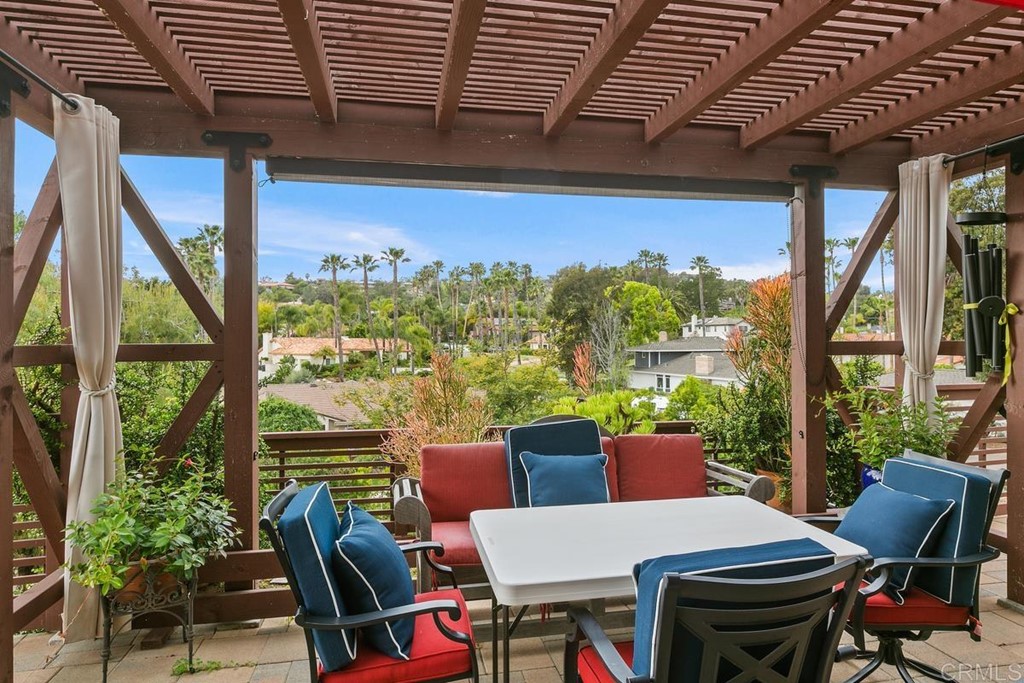 230 Winterhawk Lane Encinitas, CA 92024 - Photo 23 of 28 a view of a patio with lawn chairs next to a yard