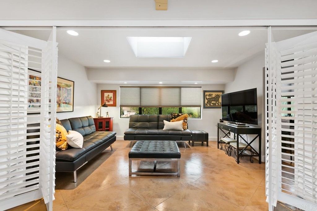 230 Winterhawk Lane Encinitas, CA 92024 - Photo 7 of 28 a living room with furniture and a flat screen tv