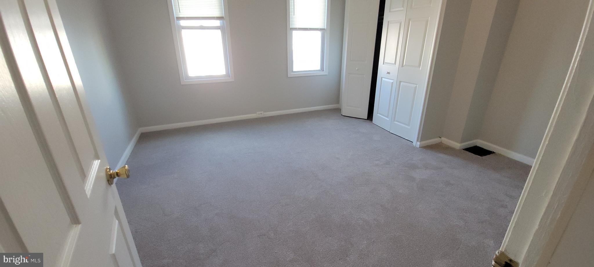 2643 Emerald Street Philadelphia, PA 19125 - Photo 14 of 14 an empty room with windows