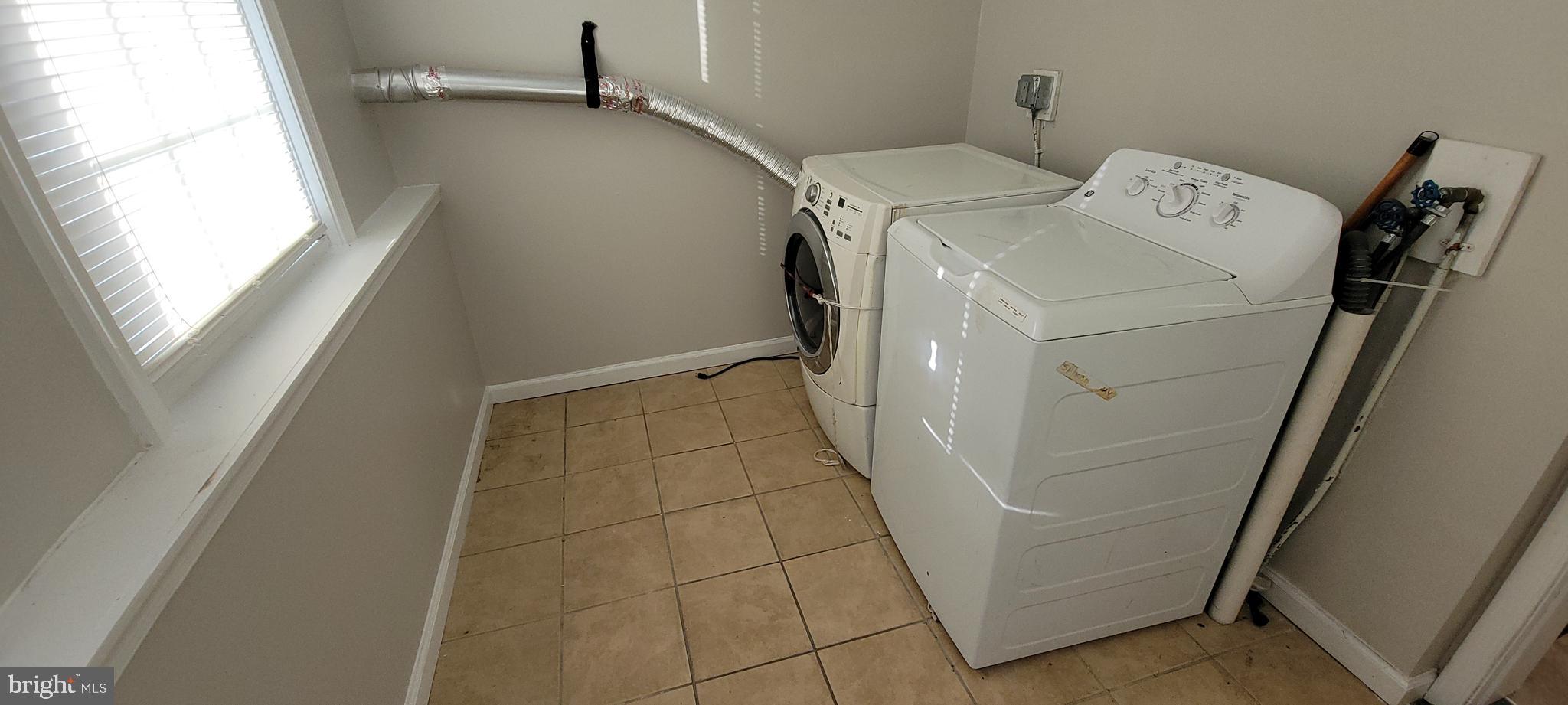 2643 Emerald Street Philadelphia, PA 19125 - Photo 6 of 14 a utility room with dryer and washer