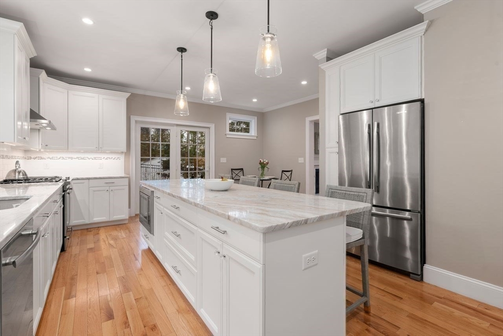 72 Great Plain Avenue Wellesley, MA 02482 - Photo 12 of 38 a large kitchen with kitchen island a sink stainless steel appliances and cabinets