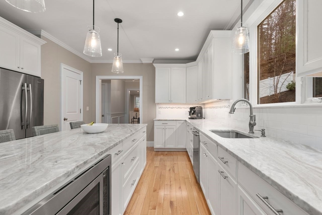 72 Great Plain Avenue Wellesley, MA 02482 - Photo 13 of 38 a spacious kitchen with stainless steel appliances granite countertop a sink stove and refrigerator