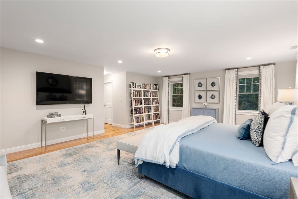 72 Great Plain Avenue Wellesley, MA 02482 - Photo 20 of 38 a bedroom with a bed and a flat screen tv