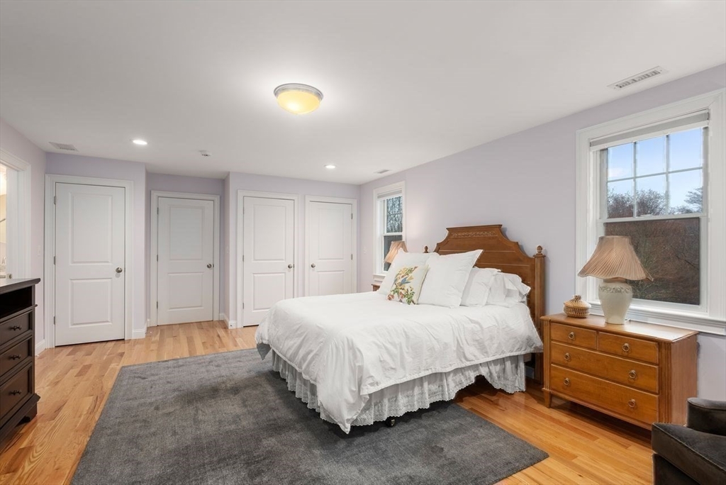 72 Great Plain Avenue Wellesley, MA 02482 - Photo 23 of 38 a bedroom with a bed and a flat screen tv