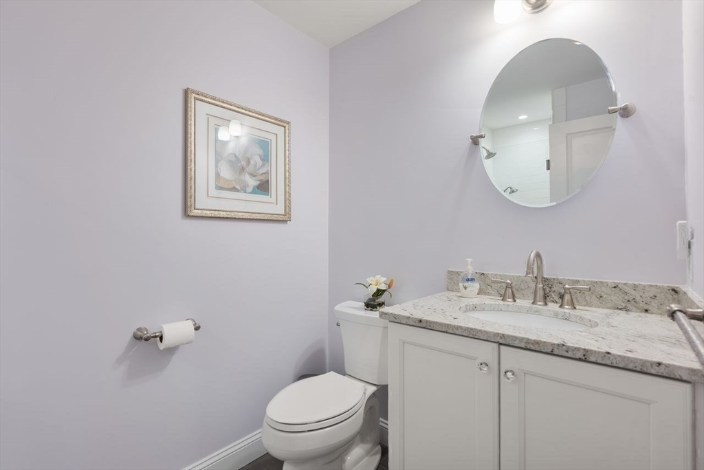 72 Great Plain Avenue Wellesley, MA 02482 - Photo 24 of 38 a bathroom with a granite countertop sink mirror and toilet