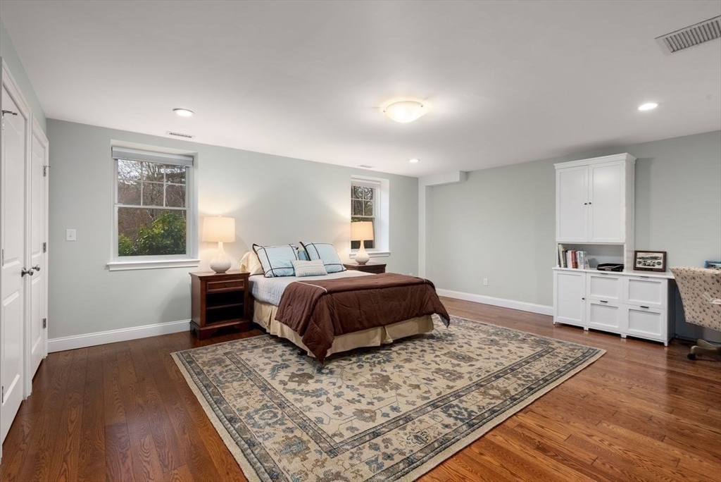 72 Great Plain Avenue Wellesley, MA 02482 - Photo 33 of 38 a bedroom with a large bed and a window