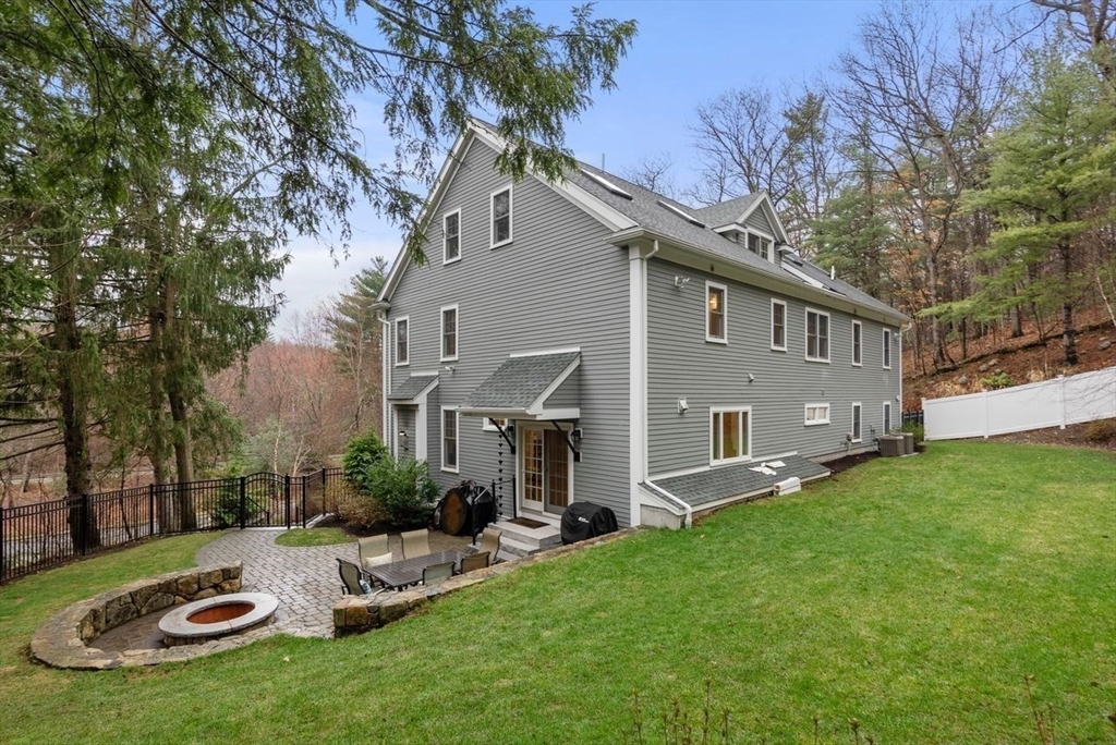 72 Great Plain Avenue Wellesley, MA 02482 - Photo 35 of 38 a view of a house with backyard and furniture