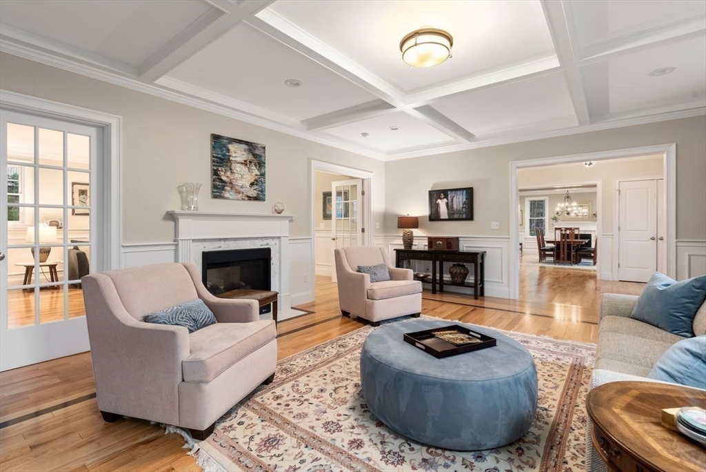 72 Great Plain Avenue Wellesley, MA 02482 - Photo 7 of 38 a living room with furniture and a fireplace