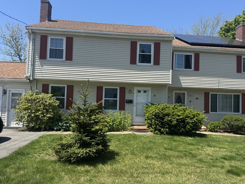 38 Crescent Road, Unit 38 Needham, MA 02494 - Photo 1 of 23 a front view of house with yard and green space