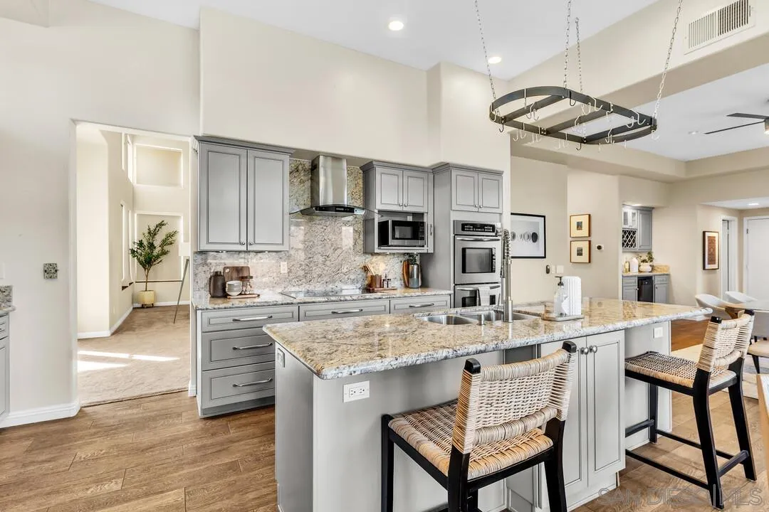 1198 Hanover Place Alpine, CA 91901 - Photo 20 of 68 a kitchen with stainless steel appliances granite countertop a sink and a refrigerator