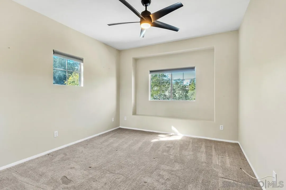 1198 Hanover Place Alpine, CA 91901 - Photo 50 of 68 an empty room with windows and fan