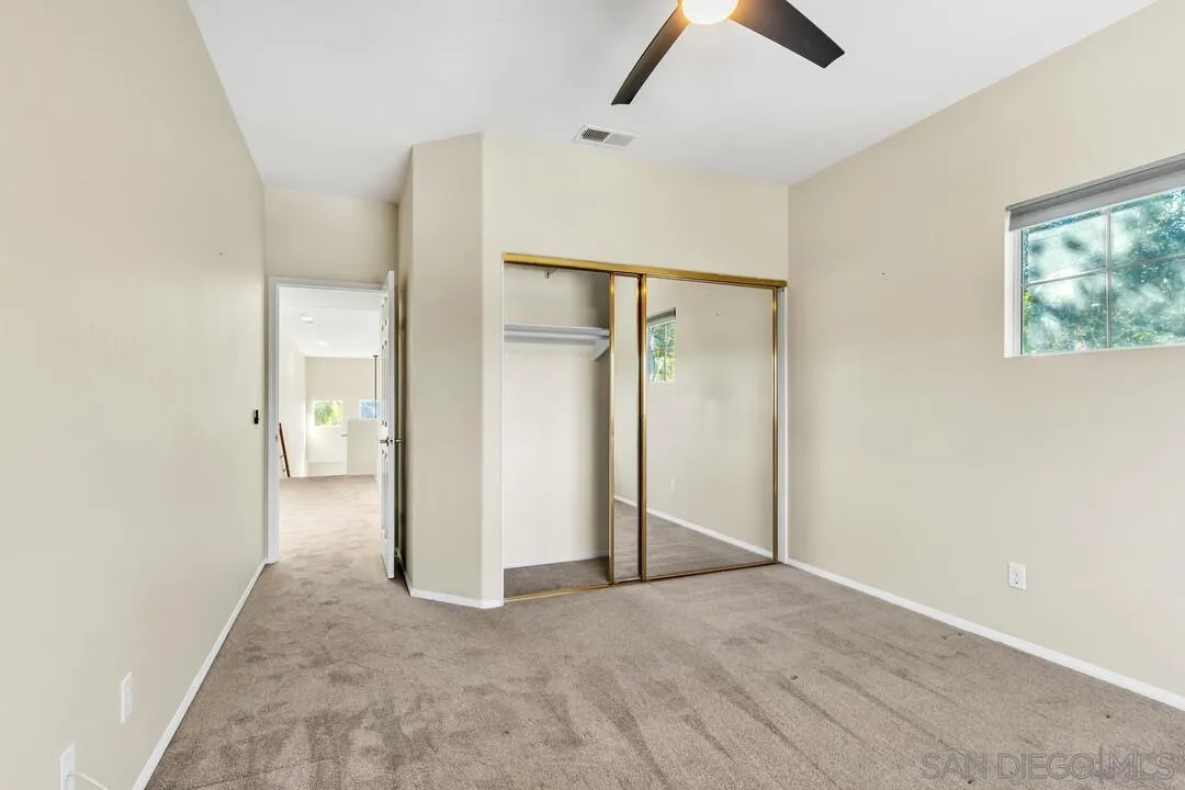 1198 Hanover Place Alpine, CA 91901 - Photo 51 of 68 an empty room with closet and a chandelier fan