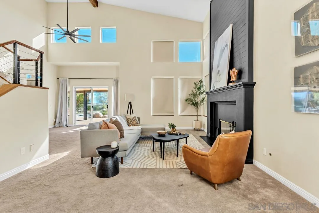 1198 Hanover Place Alpine, CA 91901 - Photo 6 of 68 a living room with furniture a fireplace and a chandelier