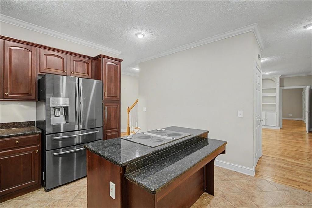 1136 Cole Lake Road Dallas, GA 30157 - Photo 22 of 72 a kitchen that has a stainless steel appliances cabinets and a counter top space