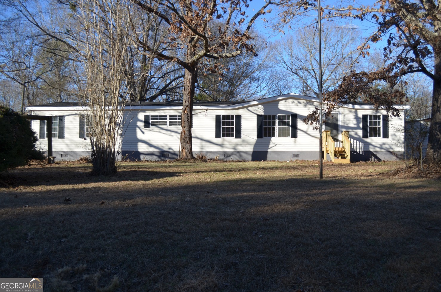 158 Charles Johnson Road Forsyth, GA 31029 - Photo 1 of 1 a front view of house with yard