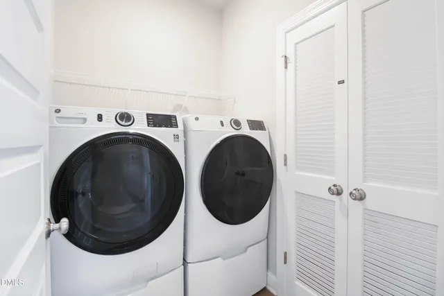 a utility room with dryer and washer