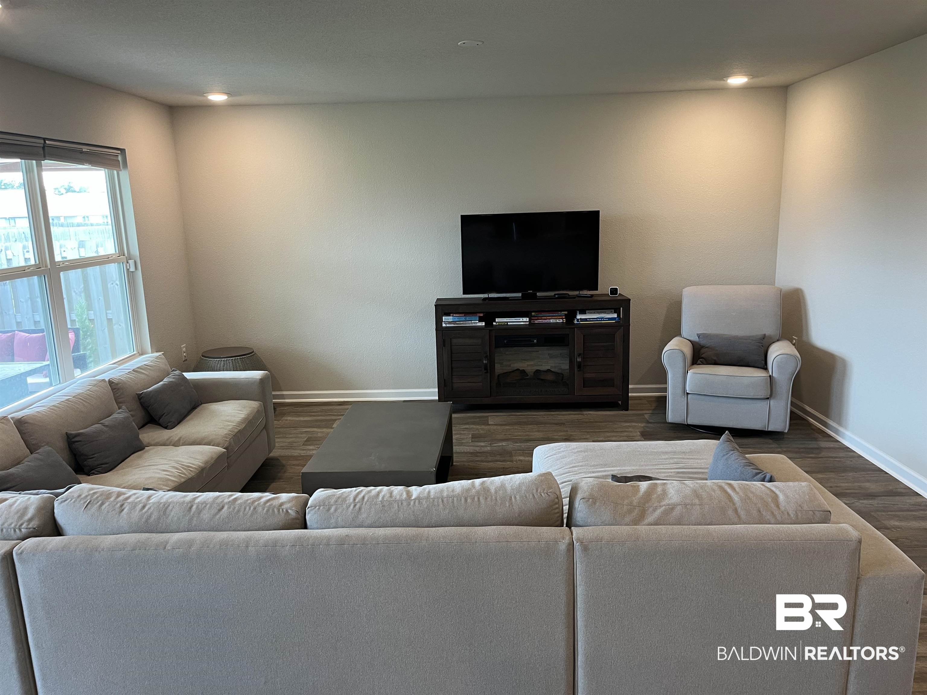 7952 Irwin Loop Daphne, AL 36526 - Photo 6 of 22 Living room featuring dark hardwood / wood-style flooring
