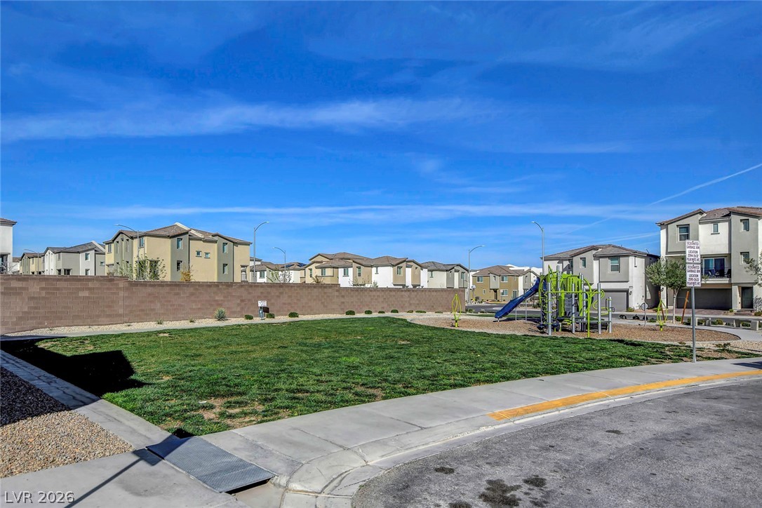 6924 Spicy Merlot Street North Las Vegas, NV 89086 - Photo 55 of 83 A vibrant neighborhood park offers recreation for all, surrounded by modern homes.